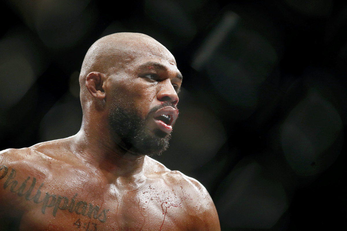 Jon Jones (red gloves) fights Dominick Reyes (not pictured) during UFC 247 at Toyota Center.